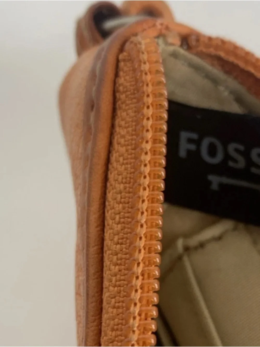 Fossil leather wristlet